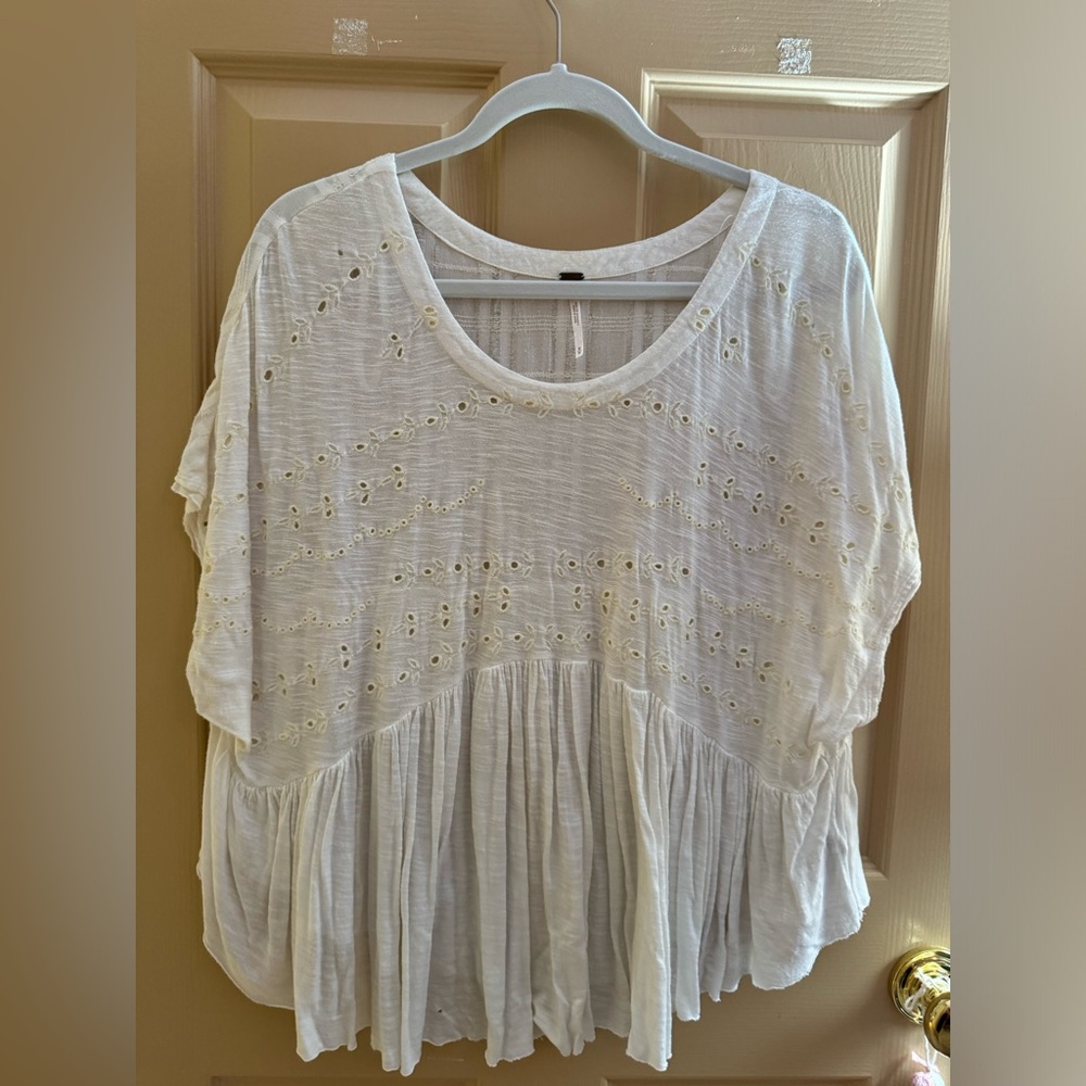 White eyelet top with ruffle hem
